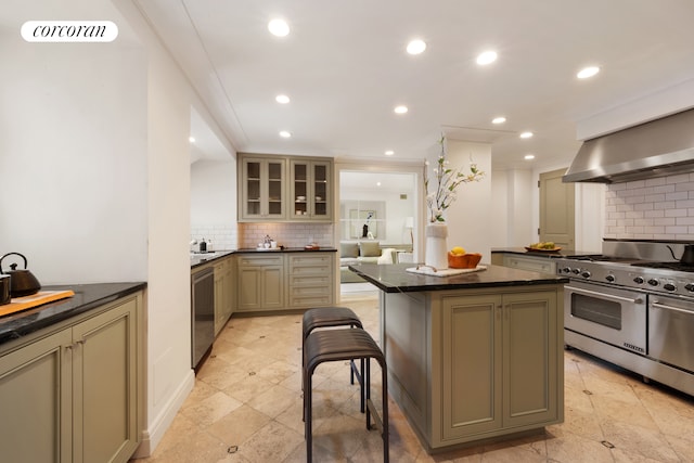 kitchen with range with two ovens, wall chimney exhaust hood, tasteful backsplash, recessed lighting, and dishwasher