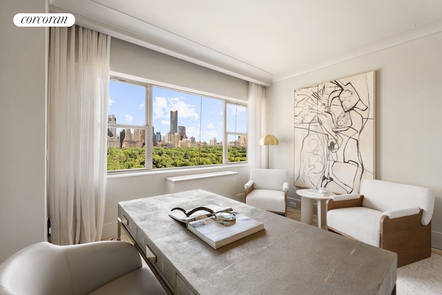 dining space with a view of skyline and baseboards