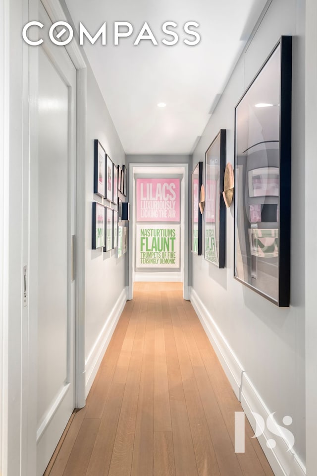 135 E 79th St Unit 8E, New York City, NY 10075 - hall featuring light wood-type flooring and baseboards