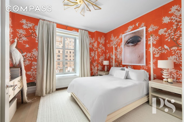 135 E 79th St Unit 8E, New York City, NY 10075 - bedroom with wood-type flooring and wallpapered walls