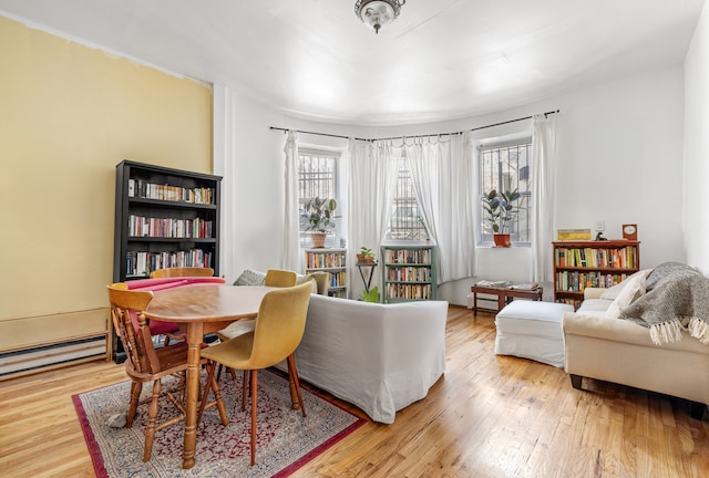 867 Riverside Dr, New York City, NY 10032 - dining room with wood finished floors and baseboard heating