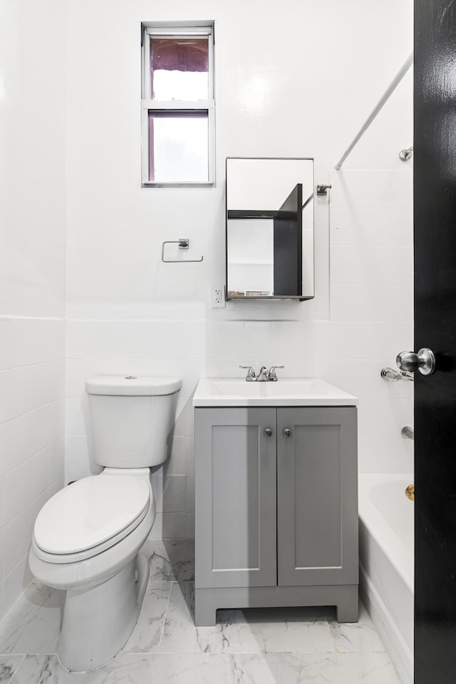 867 Riverside Dr, New York City, NY 10032 - full bath featuring vanity, toilet, marble look tiles, and shower / washtub combination