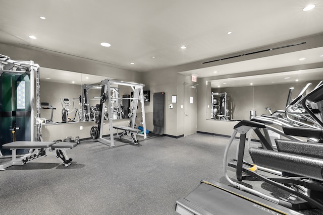 exercise room with recessed lighting and baseboards