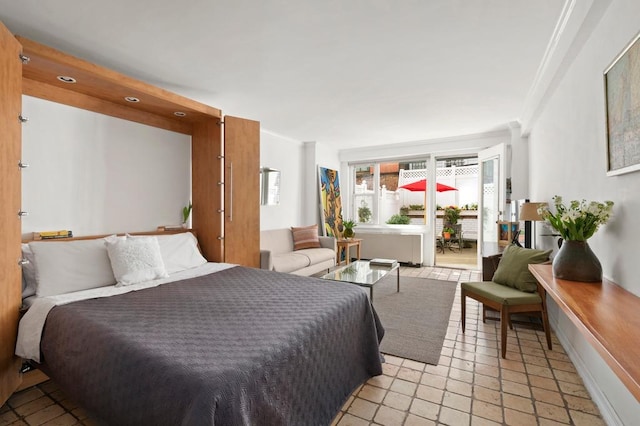 bedroom with crown molding, light tile patterned floors, and access to outside