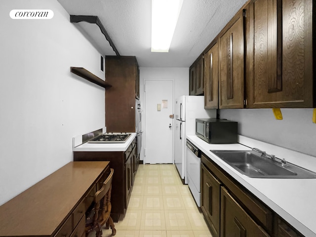 3333 Henry Hudson Pkwy Unit 8L, New York City, NY 10463 - kitchen with black microwave, open shelves, white dishwasher, light flooring, and dark brown cabinetry