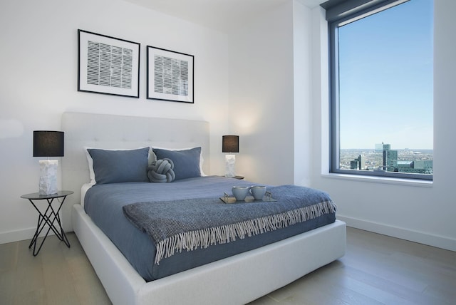 3 Court Sq Unit 6011, New York City, NY 11101 - bedroom featuring wood finished floors and baseboards