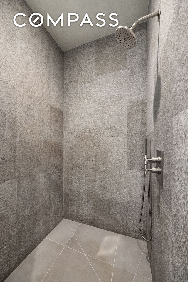 360 E 89th St Unit 29B, New York City, NY 10128 - bathroom with a tile shower and tile patterned flooring