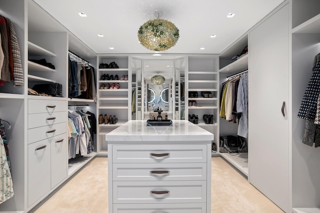 360 W 36th St Unit Ph12, New York City, NY 10018 - spacious closet featuring light carpet and a sink