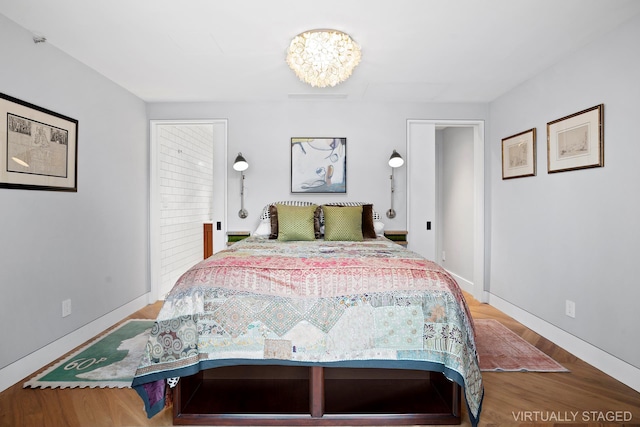 360 W 36th St Unit Ph12, New York City, NY 10018 - bedroom with wood finished floors and baseboards