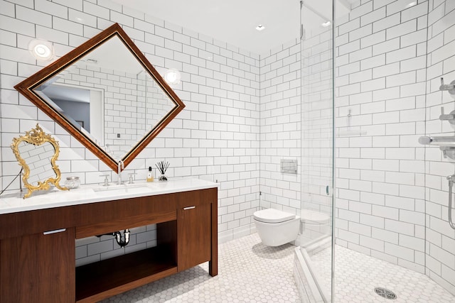 360 W 36th St Unit Ph12, New York City, NY 10018 - full bath featuring tile walls, toilet, a stall shower, vanity, and tile patterned flooring