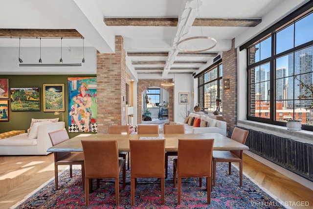 360 W 36th St Unit Ph12, New York City, NY 10018 - dining area with brick wall, beam ceiling, and coffered ceiling