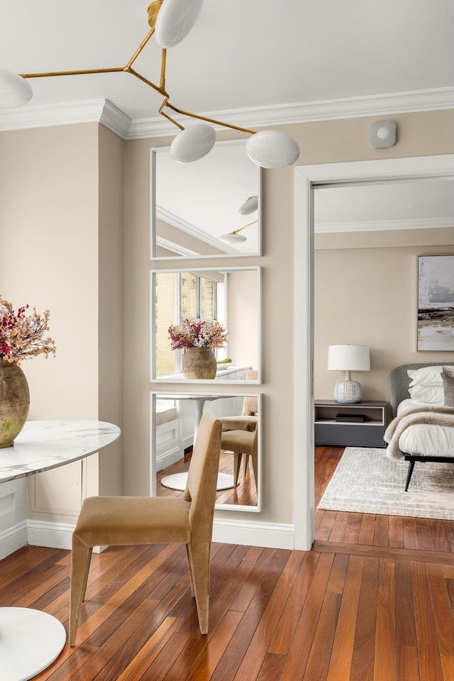 230 E 79th St Unit 12Cd, New York City, NY 10021 - dining area featuring ornamental molding, wood-type flooring, and baseboards