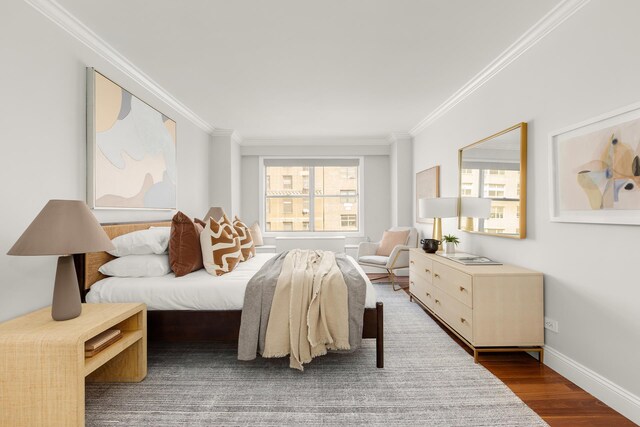 230 E 79th St Unit 12Cd, New York City, NY 10021 - bedroom featuring crown molding, wood finished floors, and baseboards