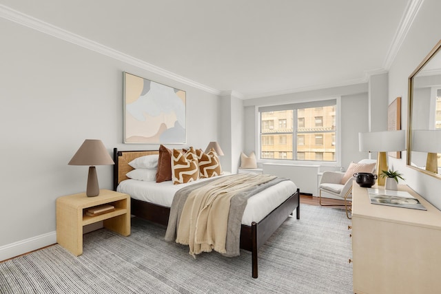 230 E 79th St Unit 12Cd, New York City, NY 10021 - bedroom featuring ornamental molding, baseboards, radiator heating unit, and light wood-style flooring