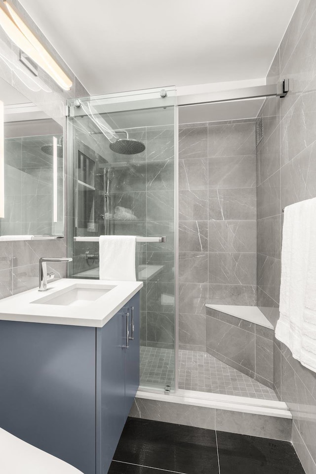 230 E 79th St Unit 12Cd, New York City, NY 10021 - full bath with a shower stall, vanity, and tile walls