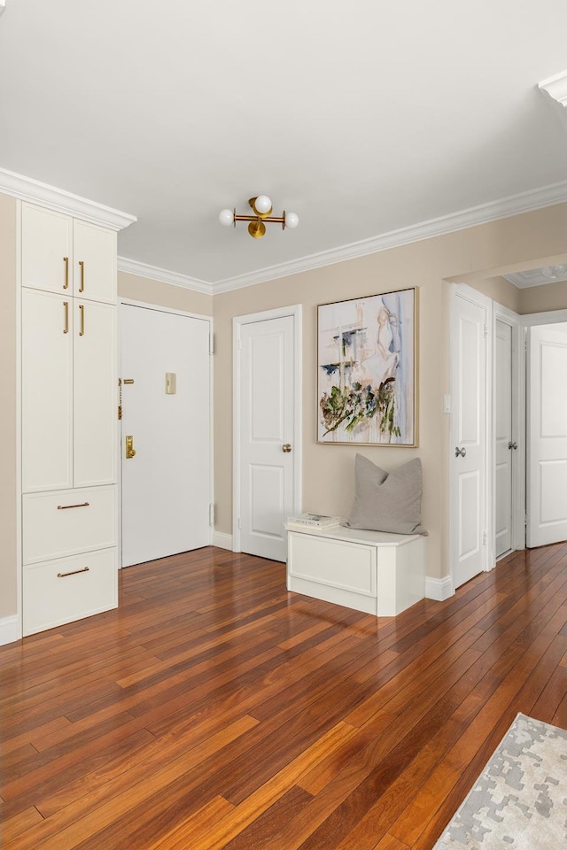 230 E 79th St Unit 12Cd, New York City, NY 10021 - foyer featuring hardwood / wood-style floors, crown molding, and baseboards