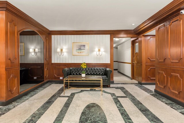 230 E 79th St Unit 12Cd, New York City, NY 10021 - building lobby with crown molding, a wainscoted wall, and wooden walls