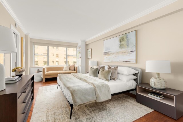 230 E 79th St Unit 12Cd, New York City, NY 10021 - bedroom with wood finished floors and ornamental molding