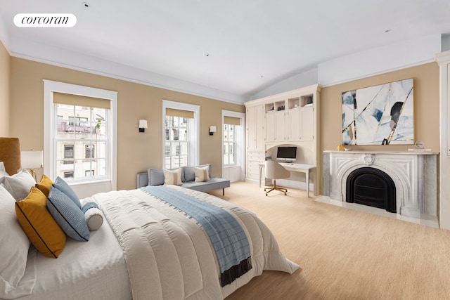 159 E 61st St, New York City, NY 10065 - bedroom with multiple windows, lofted ceiling, light carpet, and a fireplace with flush hearth