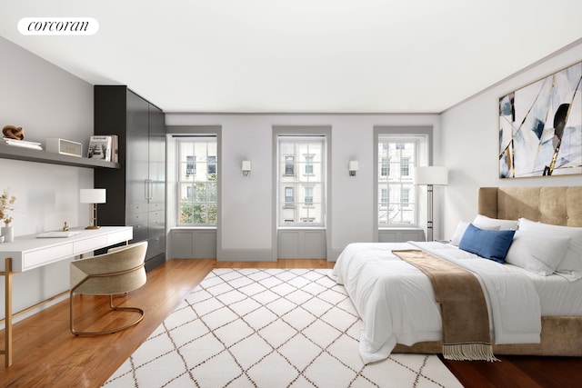 159 E 61st St, New York City, NY 10065 - bedroom featuring light wood-style floors and multiple windows