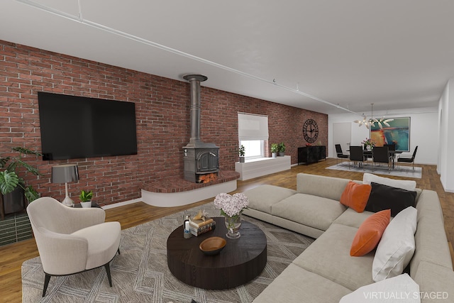 407 E 91st St Unit 5F, New York City, NY 10128 - living room with wood finished floors, brick wall, and a wood stove