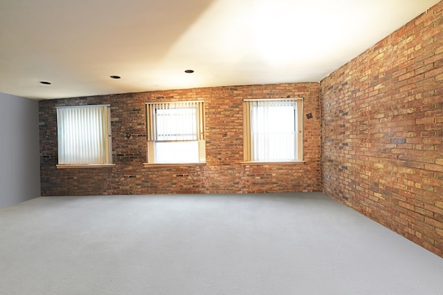 407 E 91st St Unit 5F, New York City, NY 10128 - carpeted empty room with brick wall