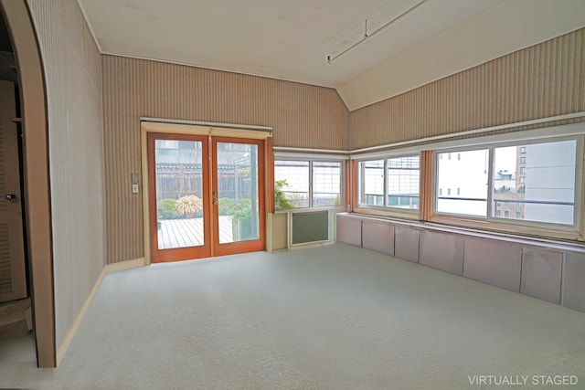 407 E 91st St Unit 5F, New York City, NY 10128 - unfurnished sunroom with arched walkways, lofted ceiling, and french doors