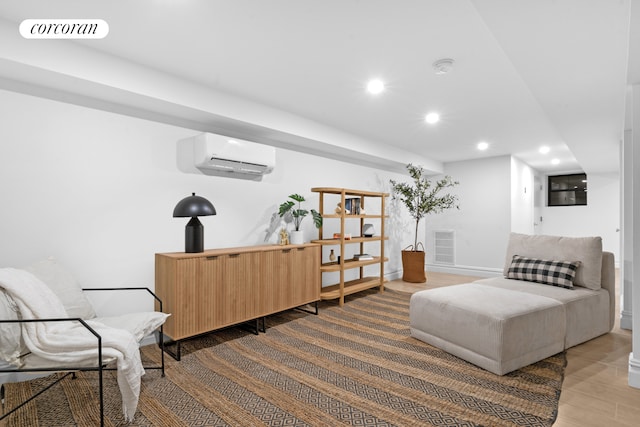 16 Goodwin Place, New York City, NY 11221 - living area featuring a wall unit AC, wood finished floors, recessed lighting, and baseboards