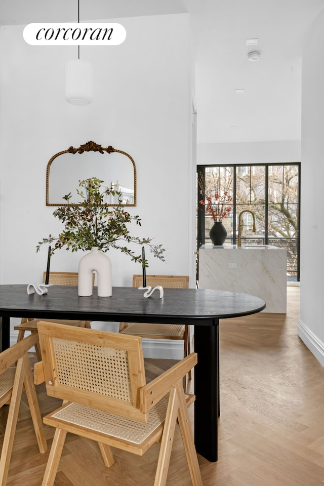 16 Goodwin Place, New York City, NY 11221 - dining room with light wood-style flooring