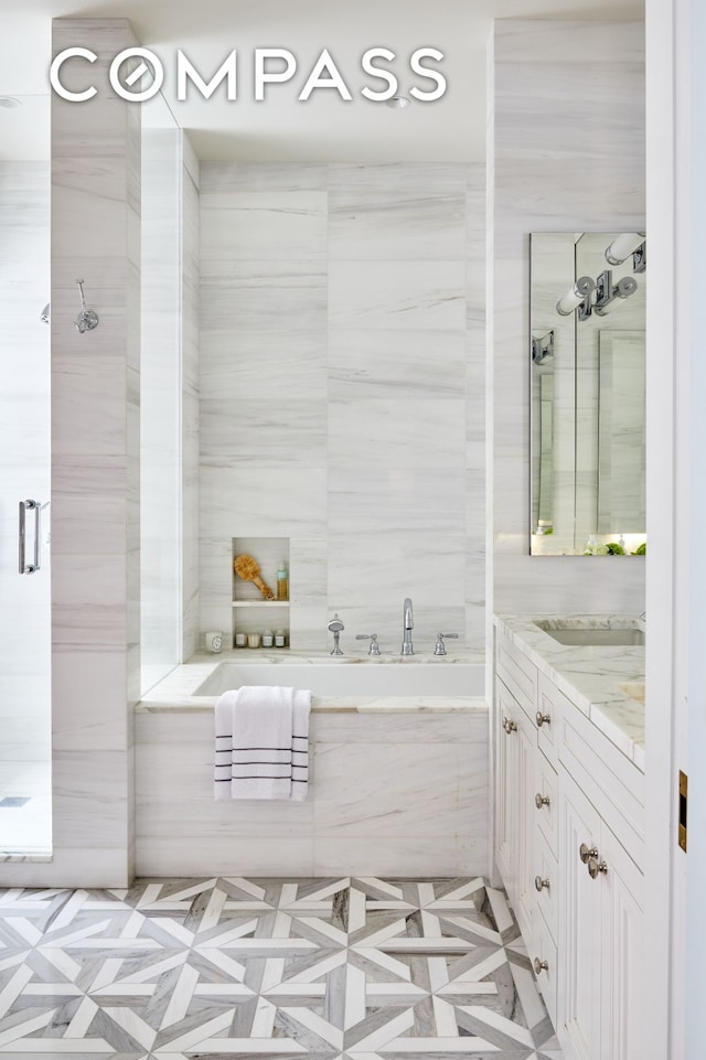 100 W 80th St Unit 5B, New York City, NY 10024 - bathroom featuring vanity, a garden tub, and a shower