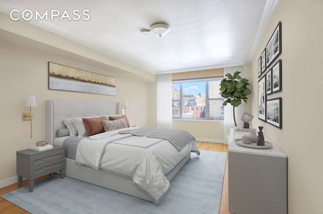 bedroom featuring baseboards, ornamental molding, and light wood-type flooring