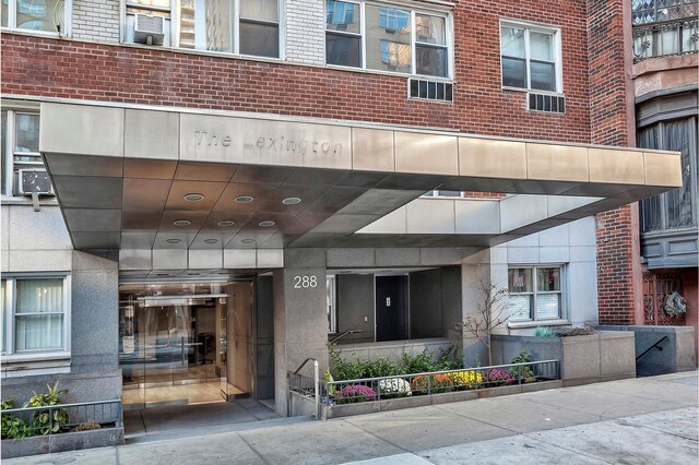 property entrance with brick siding
