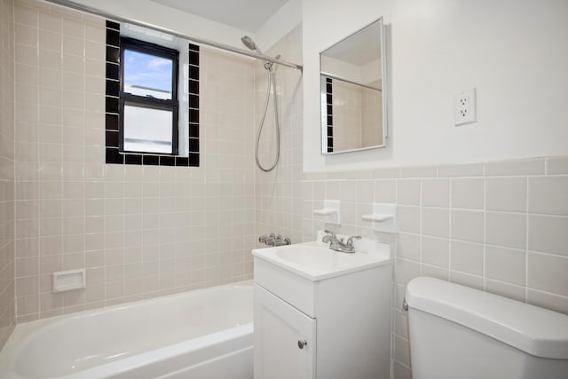 4489 Broadway Unit 5E, New York City, NY 10040 - bathroom featuring vanity, tub / shower combination, and tile walls