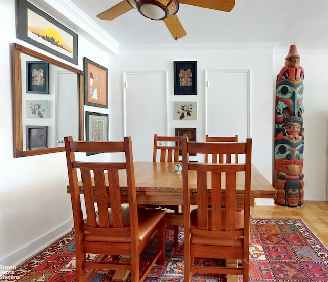 dining room with ornamental molding, a ceiling fan, a fireplace, and baseboards