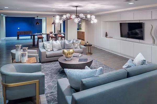 living area featuring recessed lighting, crown molding, wood finished floors, and a chandelier