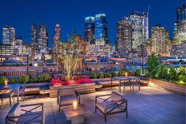 416 W 52nd St Unit 704, New York City, NY 10019 - patio at night with a view of city lights