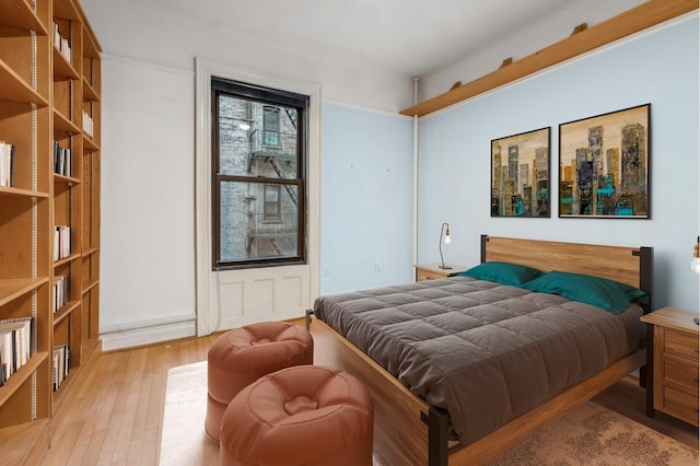 bedroom with light wood-type flooring
