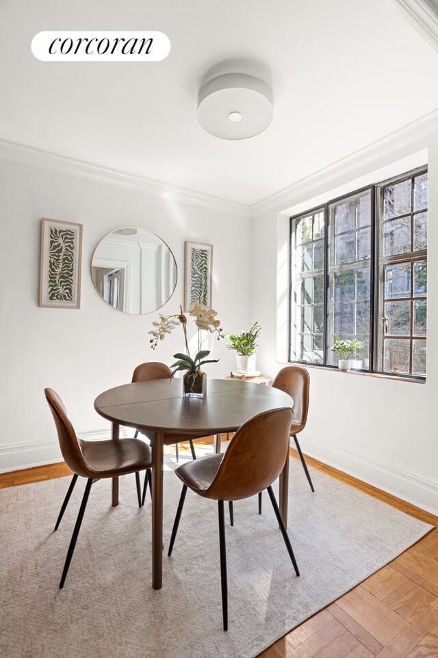116 Pinehurst Ave Unit R21, New York City, NY 10033 - dining room featuring crown molding and wood finished floors