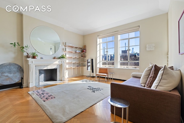 11 W 81st St Unit 6A, New York City, NY 10024 - living area with a fireplace and baseboards