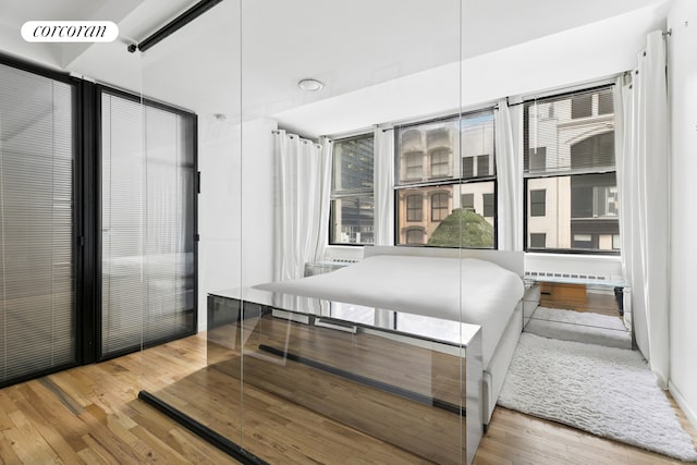 bedroom featuring wood finished floors