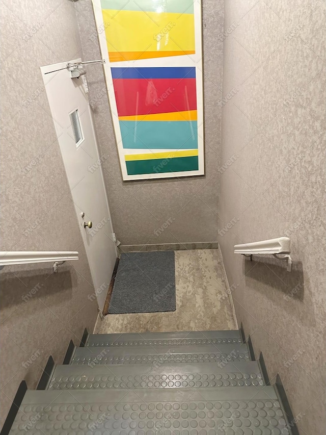 stairway with tile walls