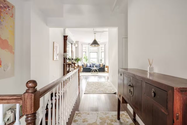 corridor with dark wood-style flooring