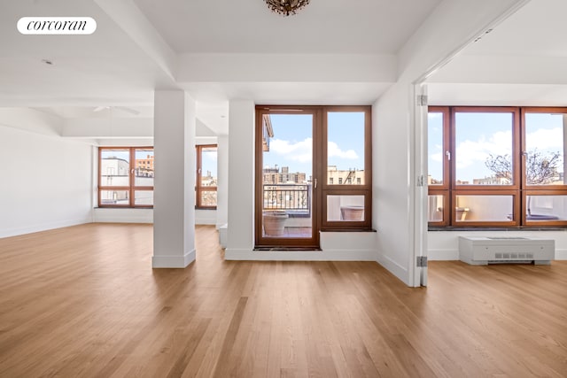 entrance foyer featuring light wood-style floors, baseboards, and ceiling fan