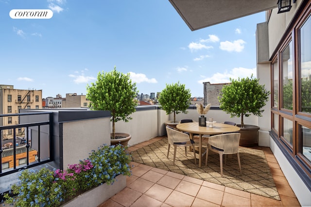 balcony featuring outdoor dining area