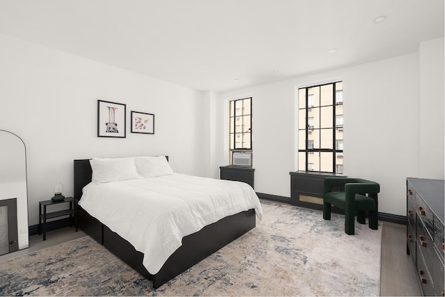 bedroom featuring baseboards and recessed lighting