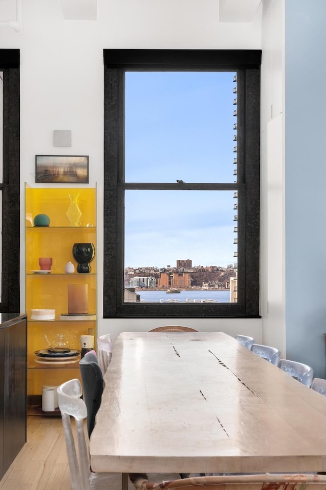 448 W 37th St Unit 9A, New York City, NY 10018 - dining area featuring wood-type flooring
