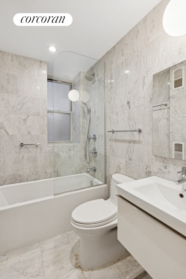 240 W 98th St Unit 3D, New York City, NY 10025 - full bath featuring toilet, tub / shower combination, vanity, tile walls, and marble finish flooring
