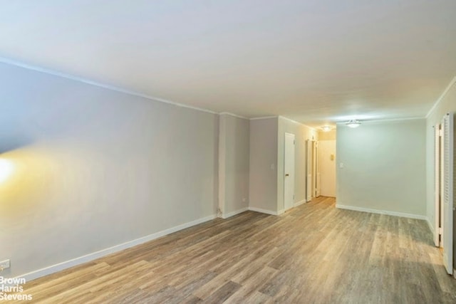 330 E 49th St Unit 3L, New York City, NY 10017 - empty room featuring wood finished floors, baseboards, and crown molding