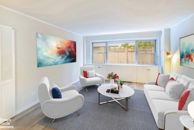 330 E 49th St Unit 3L, New York City, NY 10017 - living area with wood finished floors, baseboards, and crown molding