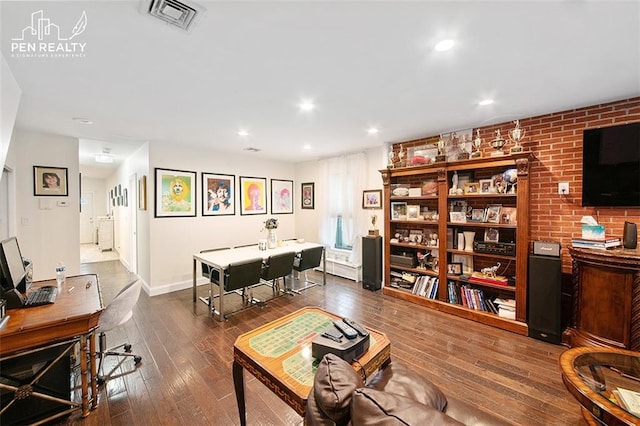 kitchen featuring a sink, appliances with stainless steel finishes, wood tiled floor, visible vents, and decorative backsplash